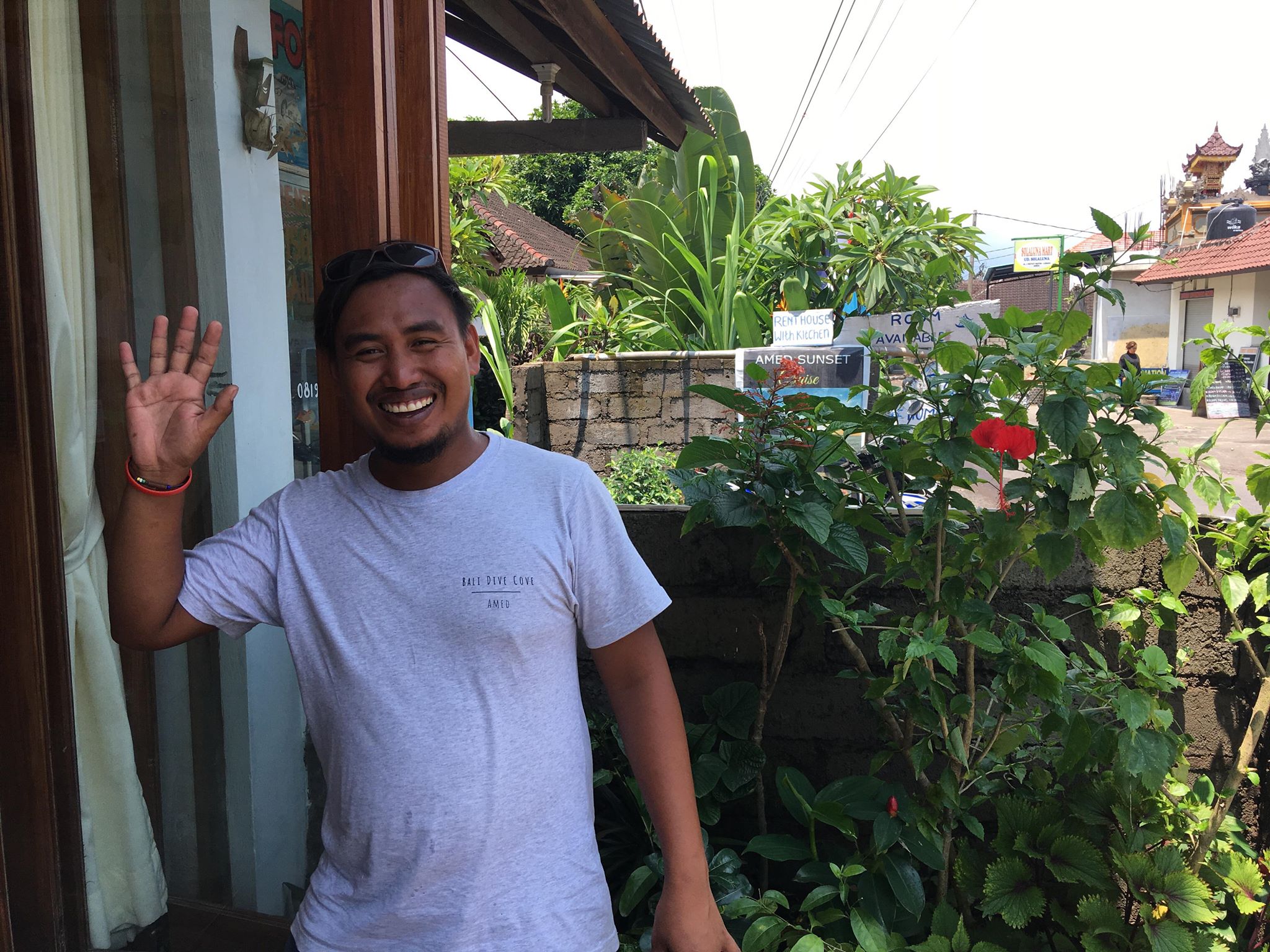 Wayan waving outside BDC