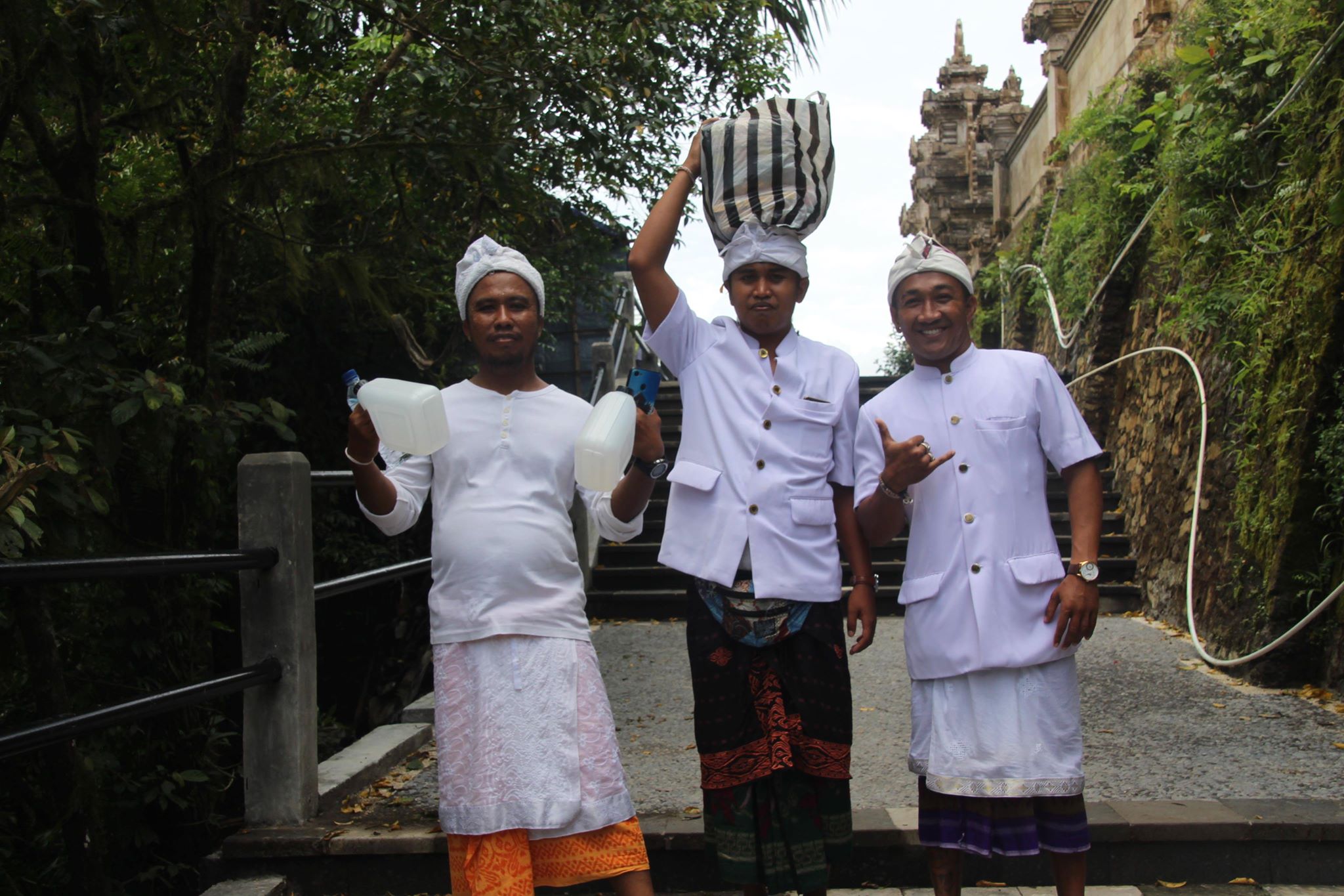 Kadek with his holy water, Tapik with the Offerings and Gede. All at Lempuyang Temple