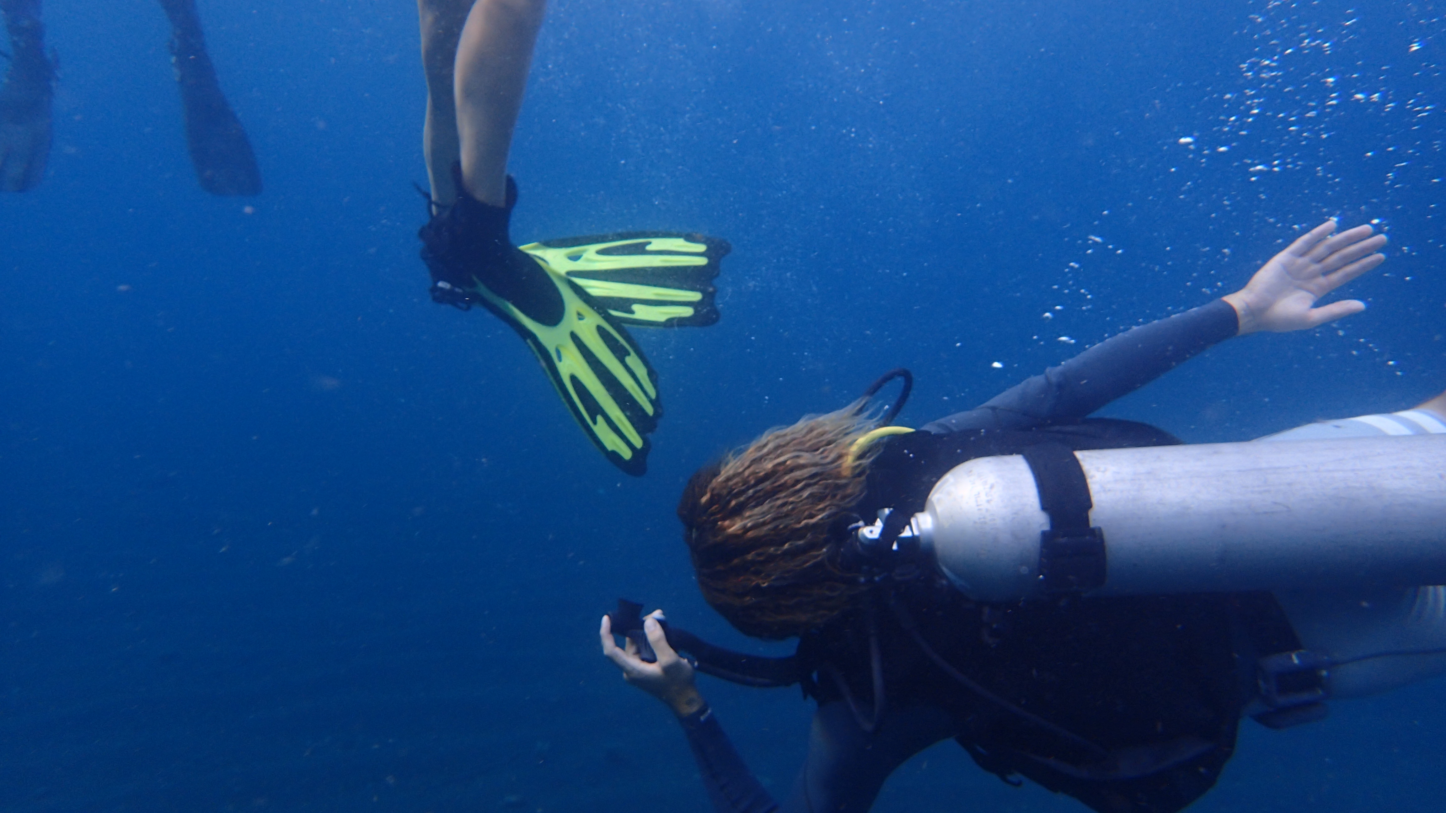 Practicing panic diver approach from underwater