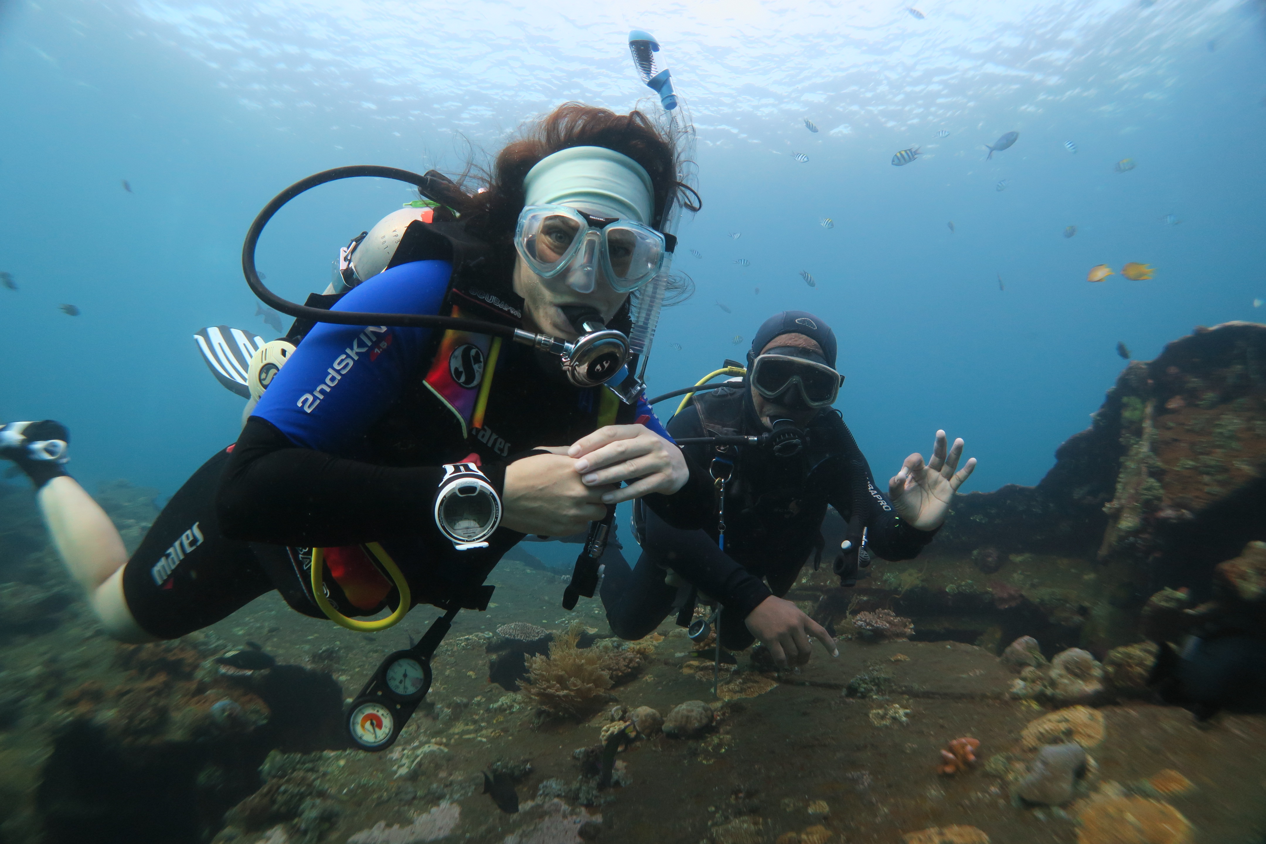 Iris and divemaster Kadek on the USAT Liberty