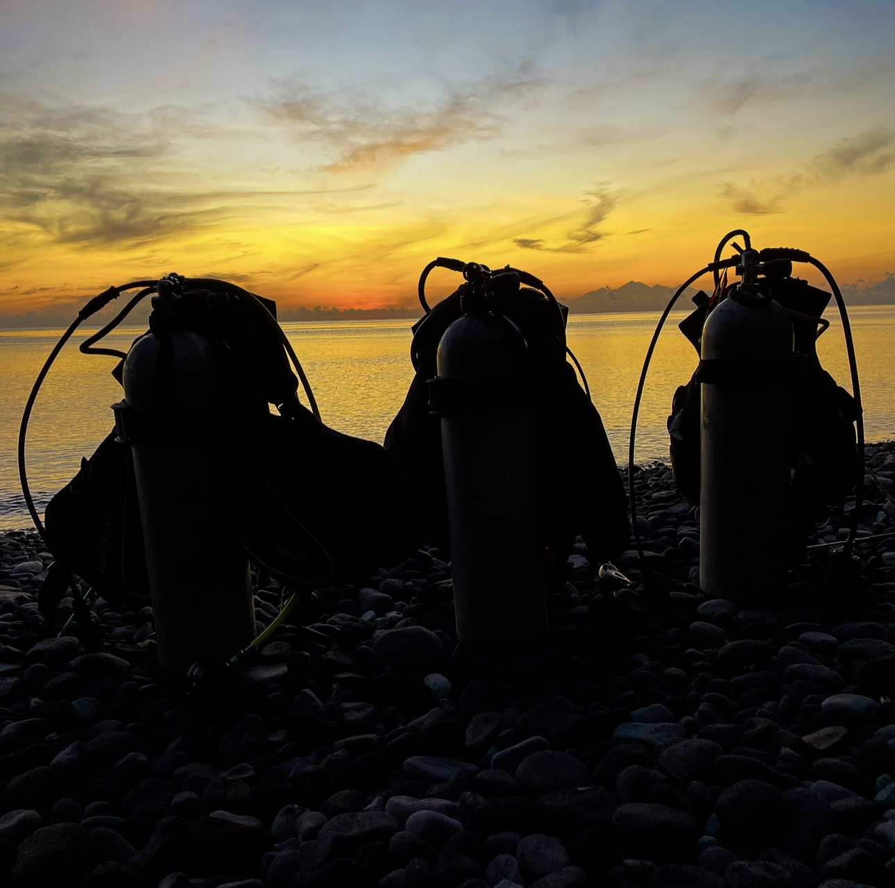 Scuba diving equipment set up ready to dive on the USAT Liberty wreck in Tulamben, Bali