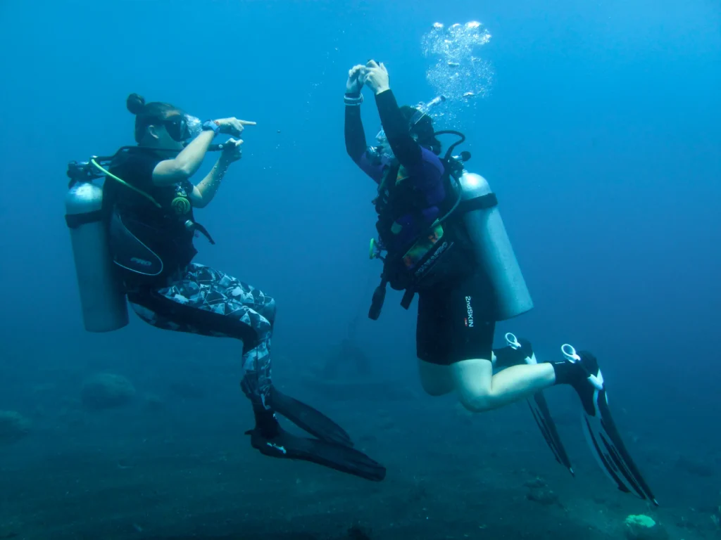 diver practicing emergency ascent in shallow water