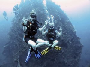 Scuba divers hanging out at the bow of the USAT Liberty shipwreck in Tulamben, Bali