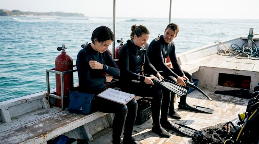 Divers prepping gear on Bali boat